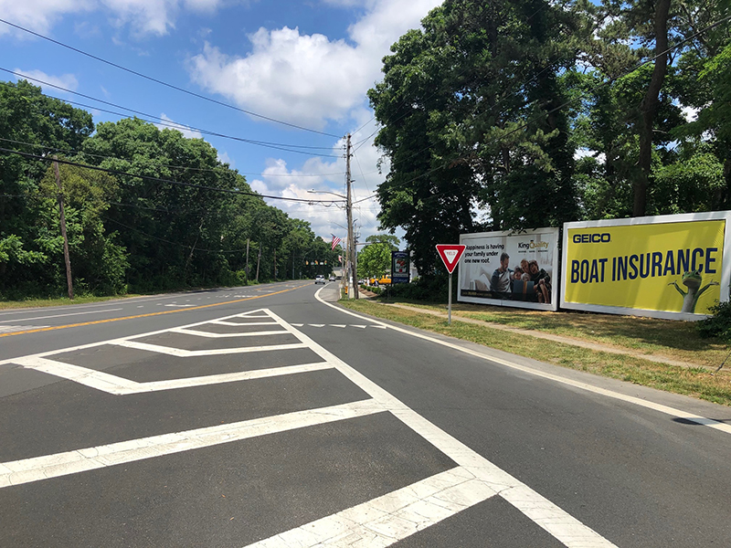 Brookhaven: south side Route 27A, 60' east of S. Country Rd., facing west Media