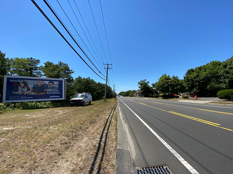 Bellport: south side of Route 27A, 30' west of Post Ave, facing west Media