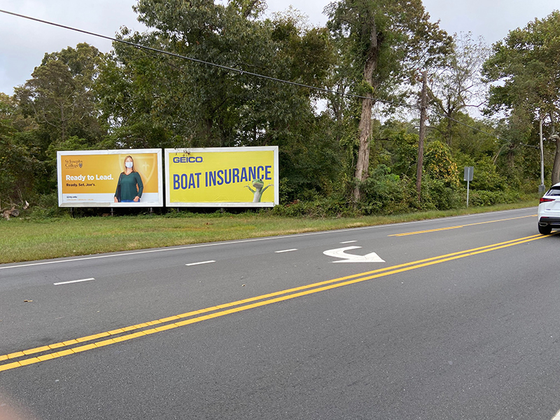 Brookhaven: north side of Route 27A, 135' east of Yaphank Ave., facing west Media