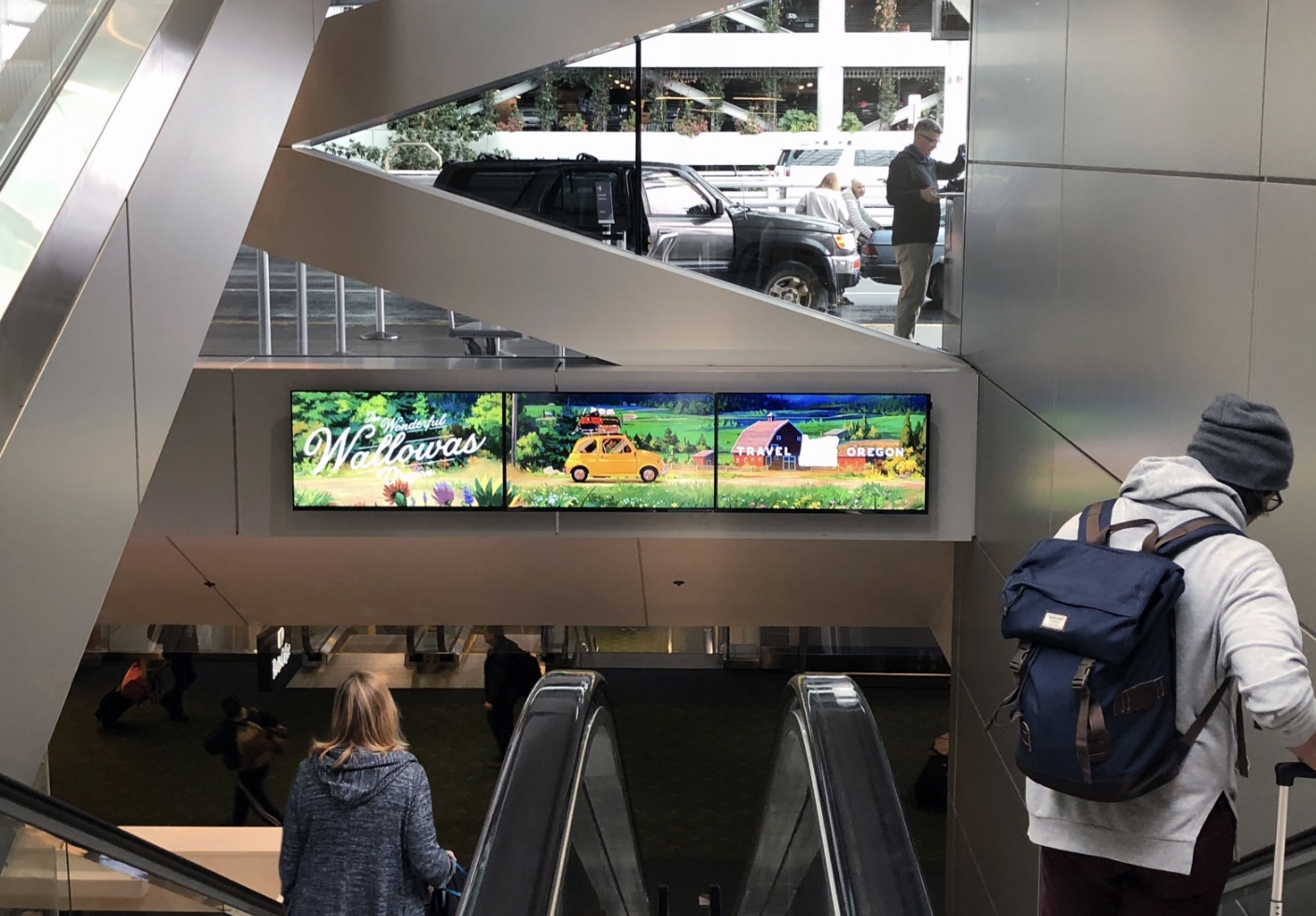 Two digital pre-security screens are positioned at the North and South ends of the main lobby. Media