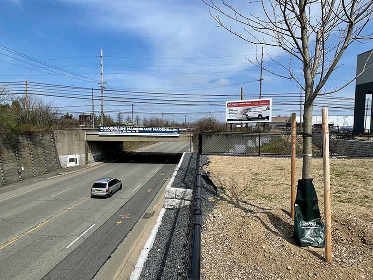 Westbury, Hicksville area, on east side Charlotte St, south of LIRR overpass, facing south Media