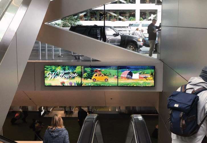 Two (2) digital pre-security screens are part of this network, located at both the North & South ends of the main ticketing lobby, as passengers make their way from the concourse to baggage claim, ground transporation and parking as they arrive in Portland. Media