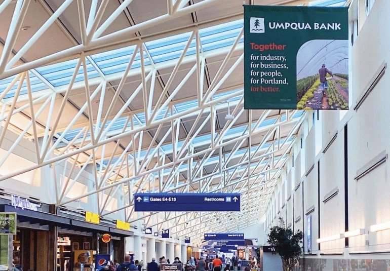 Moving Walkway Banners in Concourse E: Post-Security, hanging from the ceiling above the People Movers Media